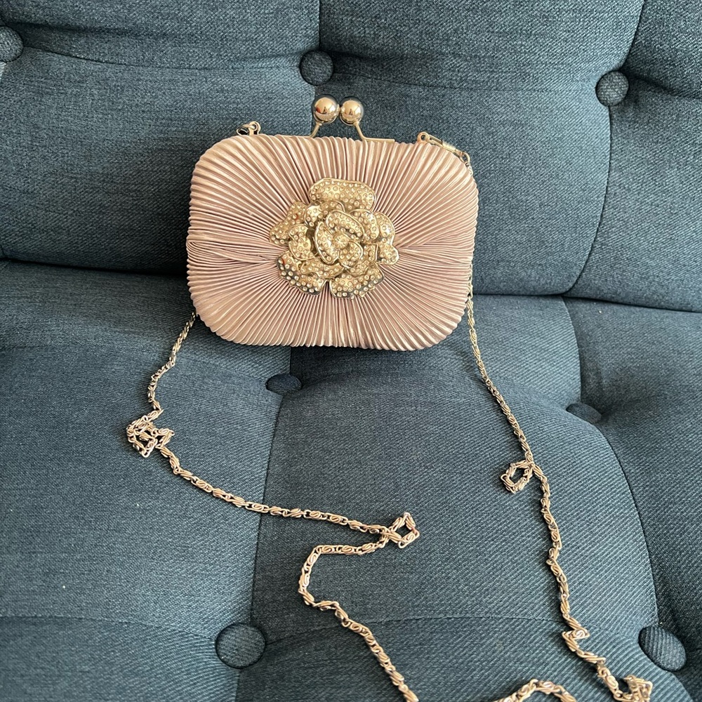 Silver Clutch with Ornate Medallion and Chain Strap